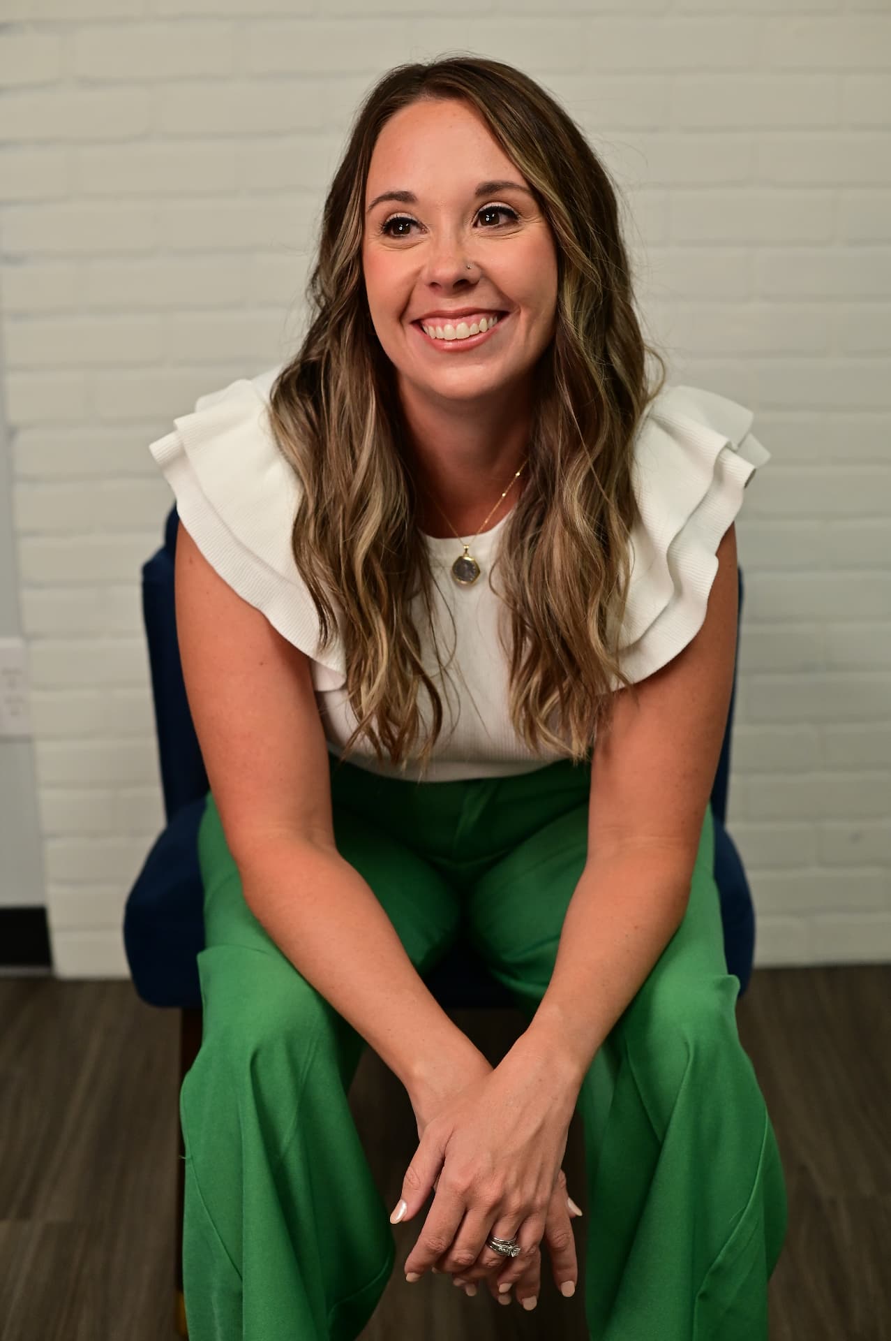 Michelle Carn seated on a couch